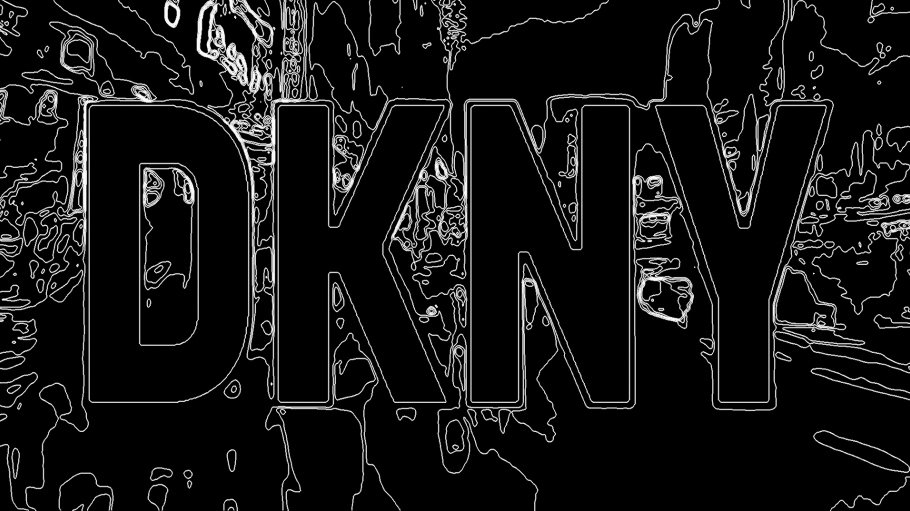 letters DKNY in black with dark abstract background