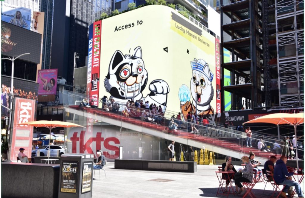 two cartoon cat NFTs shown on Times Square Billboard